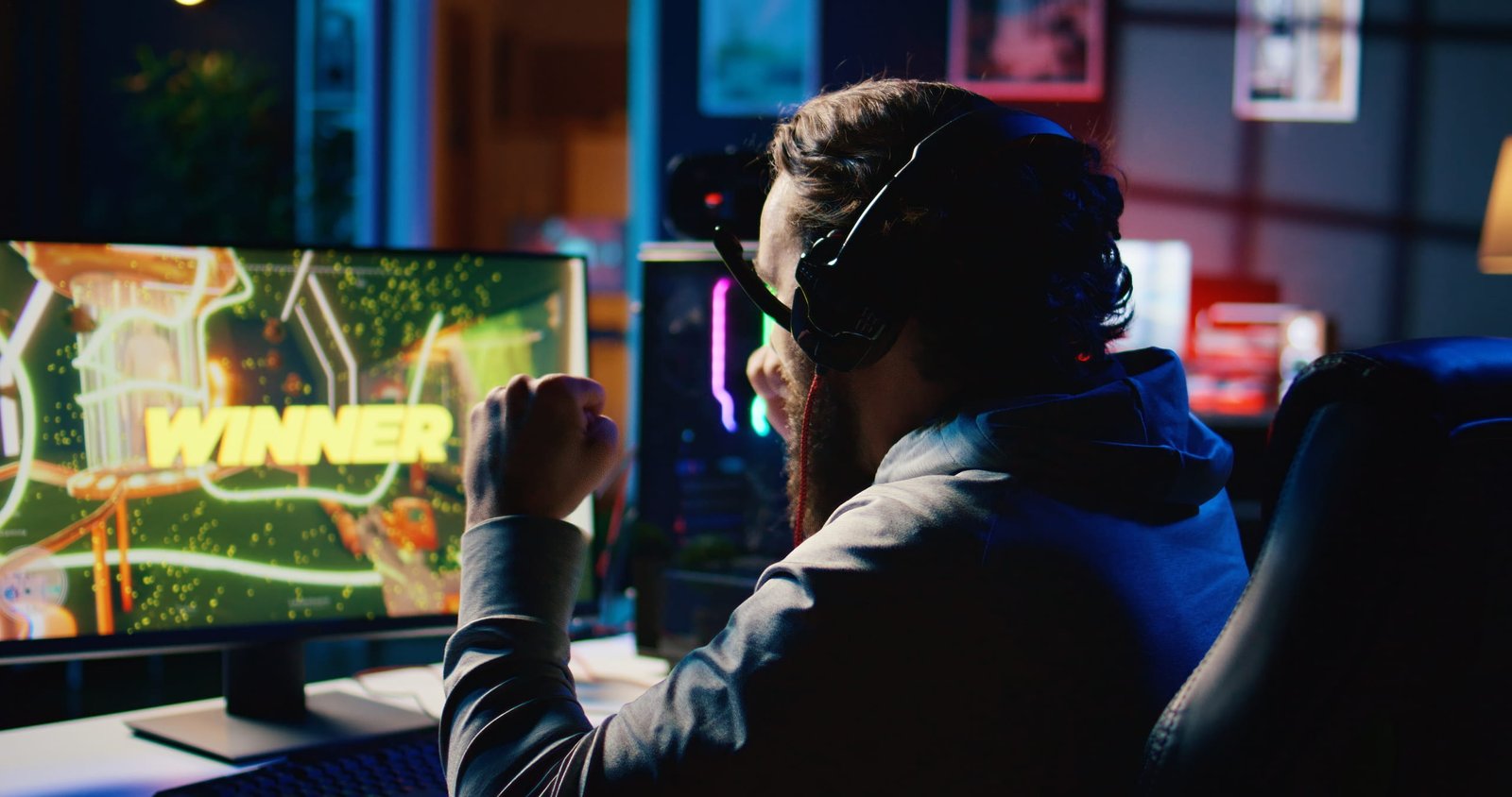 man-celebrating-victory-playing-video-game-at-home-2026-03-19-02-02-40-utc