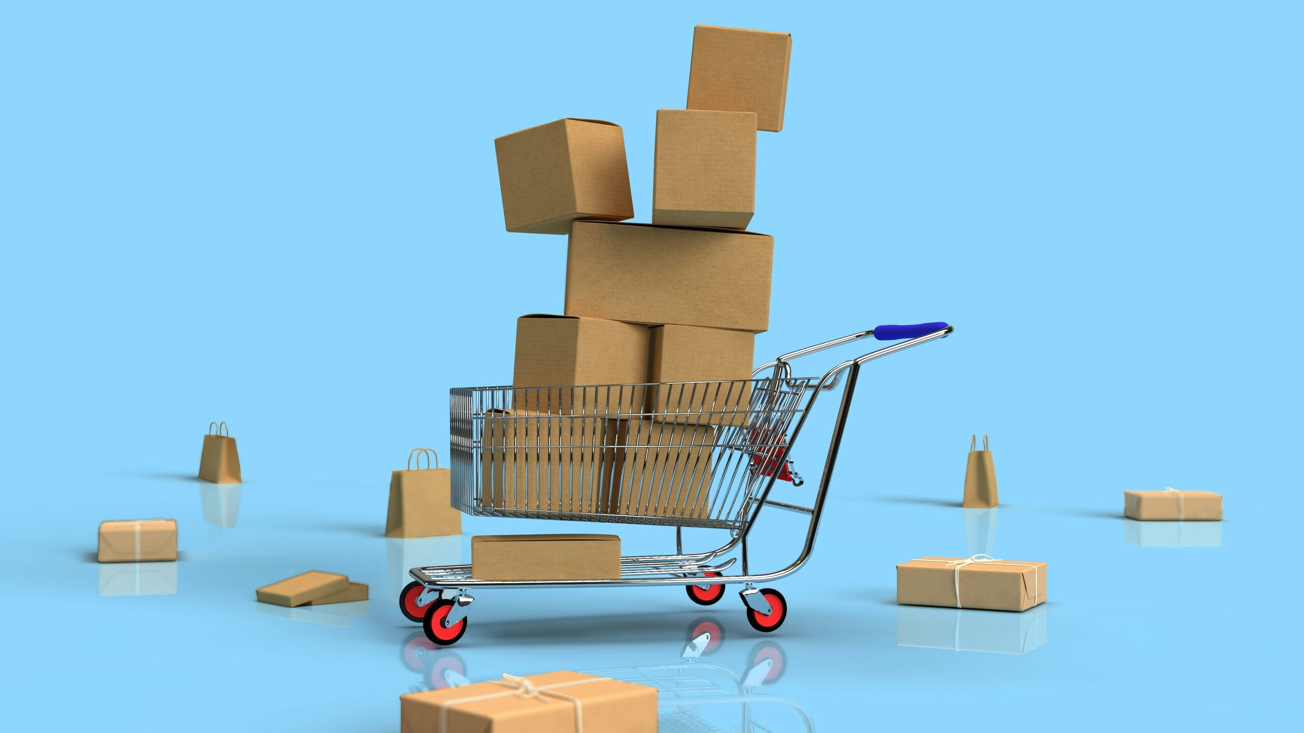 Carrito de compra con cajas de cartón y paquetes, representando los conceptos básicos del ecommerce y la logística de envíos online.